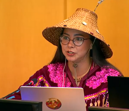 Katisha Pau speaking on behalf of the Indigenous Youth Caucus.